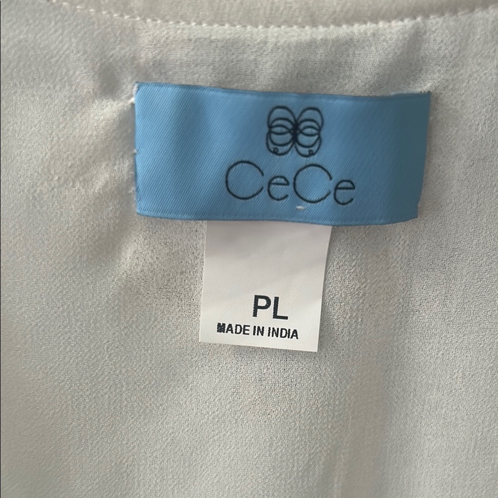 Smocked shoulders and cuffs on White 3/4 Sleeve Buttoned Blouse - Picture 2 of 4